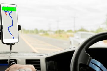 Smart phone mounted on a dash with a generic map app open